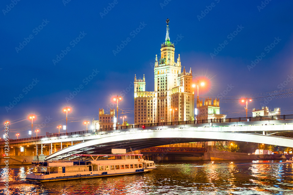 A high-rise building on Kotelnicheskaya embankment and Bolshoy Ustinsky bridge at night. Moscow A high-rise building on Kotelnicheskaya embankment and Bolshoy Ustinsky bridge at night. Moscow