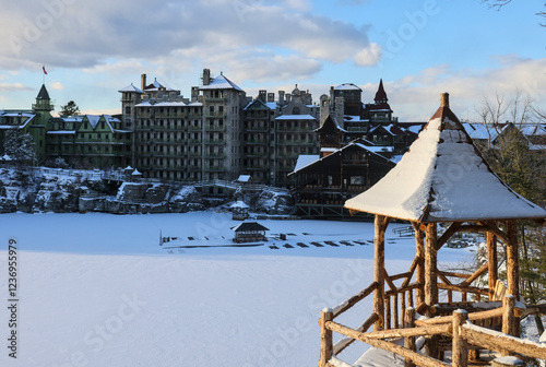 sunset view of famous hotel and wooden gazebo along hiking trail in upstate new york near new paltz (shawangunk mountain) winter snow house mohonk preserve frozen lake hike blizzard photo