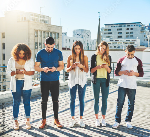 Phone, diversity and students friends in city for college freshman, networking and social media. Viral post, streaming and communication with people and mobile app outdoors for trendy news group