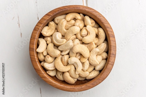 Fresh Cashew Nuts in Wooden Bowl photo