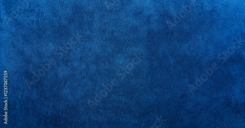 A smooth blue velvet fabric surface with a rich color, perfect for elegant designs or fashion photography. Its luxurious texture adds depth and sophistication, ideal for showcasing softness and qualit