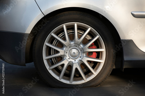 Wallpaper Mural Sunset light shines on a deflated car tire on a road. Torontodigital.ca