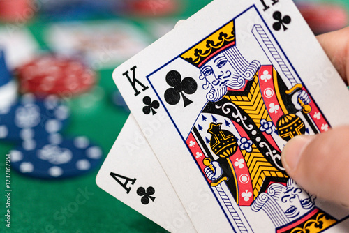 Close-up of a winning poker hand with ace and king of clubs photo