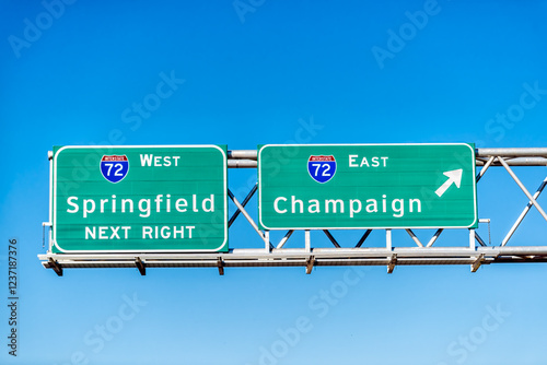 Highway 72 road in Illinois with sign exit east for Champaign and west for Springfield next right with blue sky background