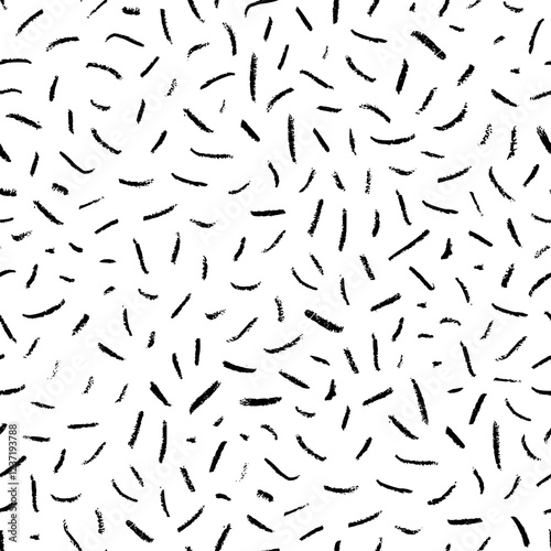 Crayon drawn simple confetti seamless pattern. Hand drawn simple short lines, dashes, pencil strokes.