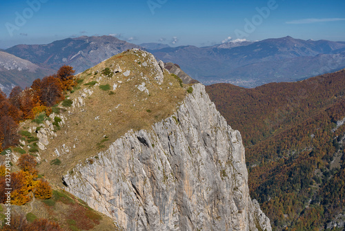 Valušnica Peak - Three Peaks Trail. Also a view of Plav town. Accursed Mountains (Prokletije National Park). Hikers visible on the peak. Montenegro, Balkans photo