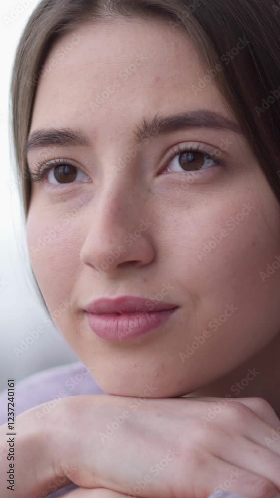 Positive woman daydreaming and contemplating, relaxing on comfortable on sofa at home. Meditation, imagination, reflection concept. Vertical video. Positive woman daydreaming and contemplating, relaxing on comfortable on sofa at home. Meditation, imagination, reflection concept. Vertical video.