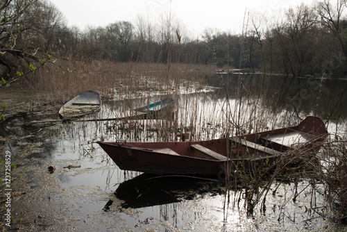 Sunken boats on sping river photo