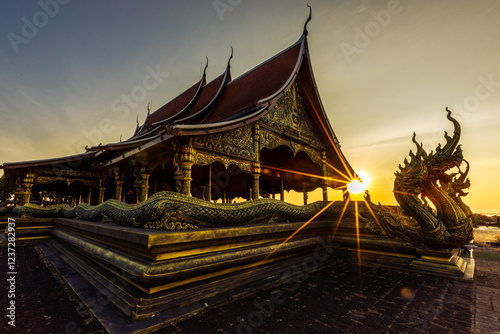 Background of the tourist attraction Wat Sirindhorn Wararam or the famous glowing temple in Thailand. Ubon Ratchathani is adjacent to Laos. Tourists always like to come to see the beauty at night. photo