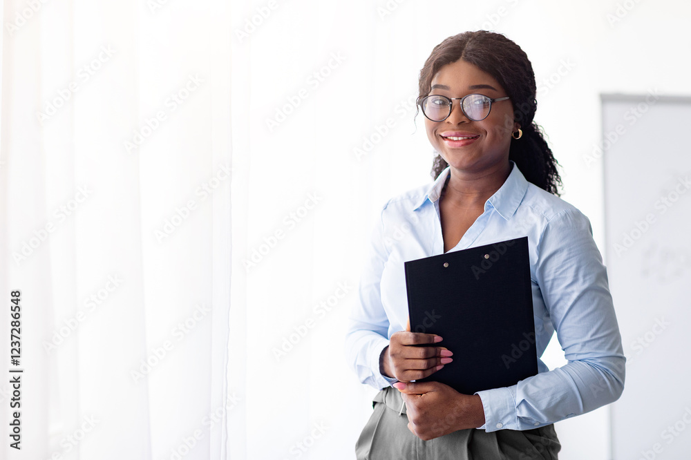 Psychological education concept. Cheerful young black business coach conducting personal growth training at office. Confident female tutor giving professional development course, indoors Psychological education concept. Cheerful young black business coach conducting personal growth training at office. Confident female tutor giving professional development course, indoors