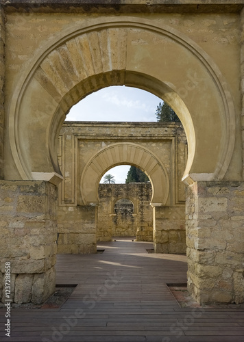 Islamic horse shoe arches of the royal palace of Medina Azahara near Cordoba Spain photo