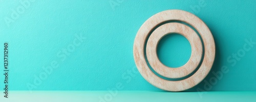 Minimalistic wooden design against a vibrant teal background, perfect for modern decor or design projects. photo