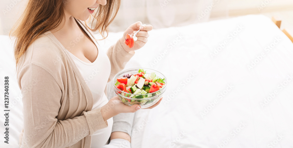 Pregnancy and health care. Pregnant woman eating salad with fresh vegetables, close up, empty space Pregnancy and health care. Pregnant woman eating salad with fresh vegetables, close up, empty space
