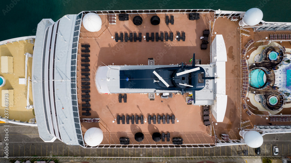 Obraz na płótnie Sun loungers arranged on the upper deck of luxurious cruise ship, passenger ship