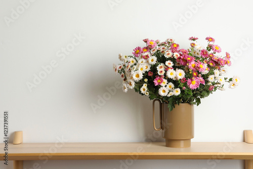 Wallpaper Mural Vase with beautiful flowers on wooden shelf near white wall, space for text Torontodigital.ca