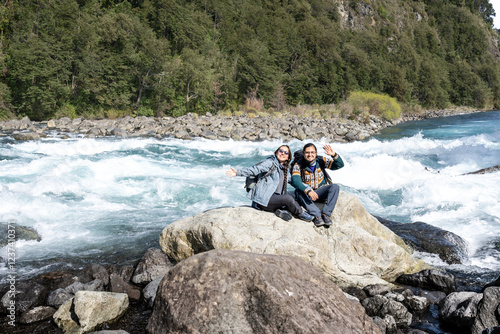 latin travelers couple in chile Saltos del Petrohue. Travelers in Chile. Lake District. Patagonia photo