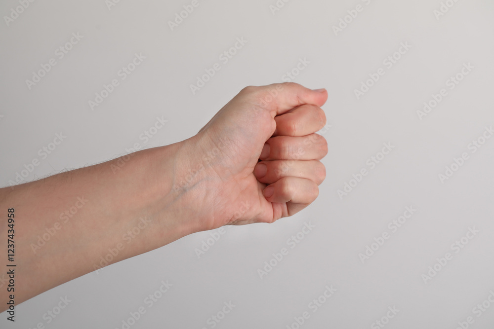 Woman with visible hand veins on light grey background, closeup. Space for text Woman with visible hand veins on light grey background, closeup. Space for text