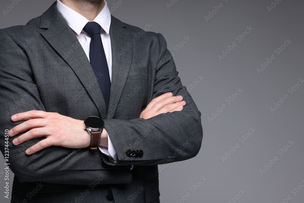 Man in classic suit on grey background, closeup. Space for text Man in classic suit on grey background, closeup. Space for text