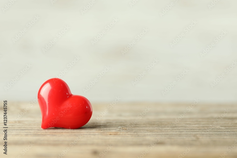 Fototapeta premium Red decorative heart on wooden table, space for text. Happy Valentine's day
