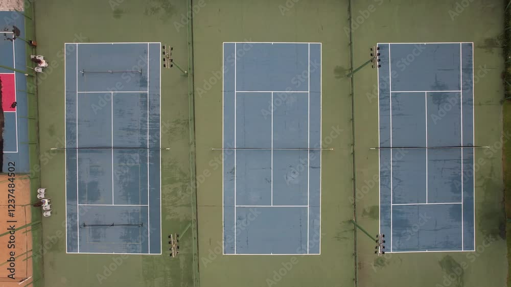 beautiful tennis courts located near the sea, drone shot raising the camera beautiful tennis courts located near the sea, drone shot raising the camera