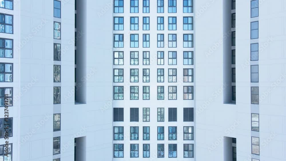 Modern white building of residential complex, urban geometry.