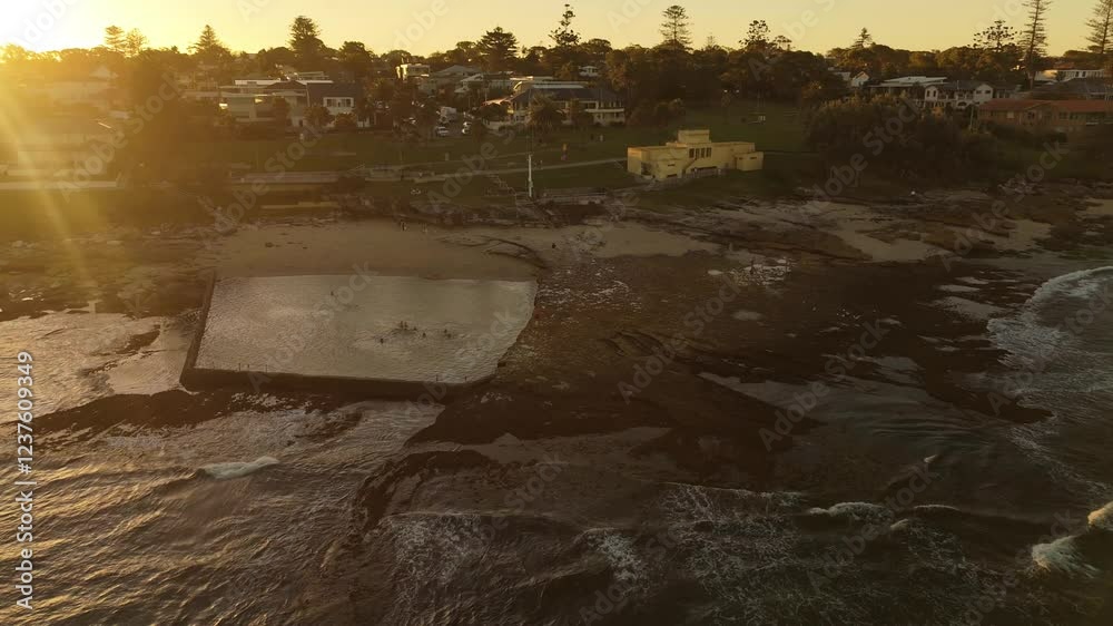Aerial drone view of Oak Park Rock Pool in Cronulla in the Sutherland Shire, South Sydney, NSW Australia during late afternoon summer in February 2025   