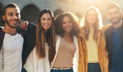 Hug, portrait and group of friends in city for smile, diversity and spring break. Students, summer vacation and college freshman with people in new york for solidarity, support or lens flare