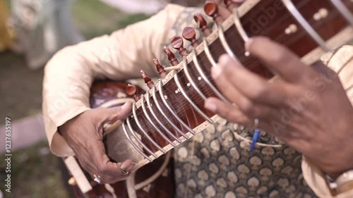 A Slow Motion Shot of a man Playing Sitar at an Indian Wedding in New Delhi, India
