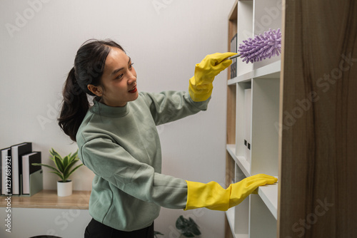 the housewife is cleaning the house, the wife is cleaning the house while waiting for her husband to com back form work, the cleaner is very attentive