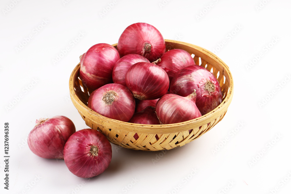 Fresh red onions in a bamboo basket. Harvest concepts. Organic vegetables.