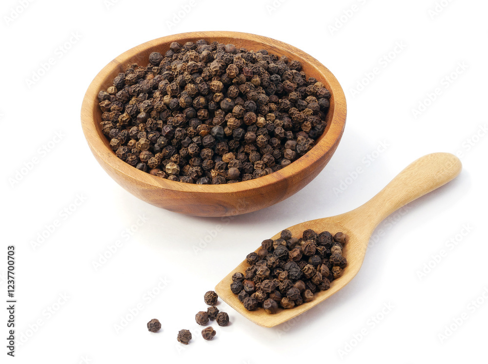 Black pepper in wooden spoon with bowl isolated on white background Black pepper in wooden spoon with bowl isolated on white background