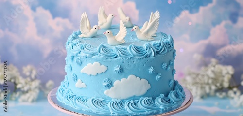 Baby blue frosting-covered cake with white dove decorations on a sky-themed backdrop. photo