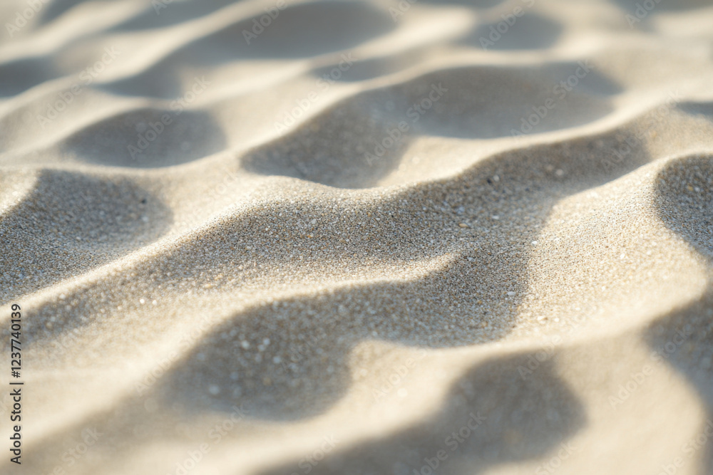 Detailed shot of fine beach sand with tiny pebbles, representing natural texture Detailed shot of fine beach sand with tiny pebbles, representing natural texture