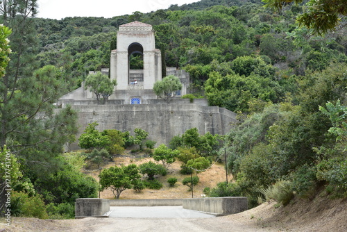 Serene Monument Surrounded by Lush Greenery in a Peaceful Natural Setting