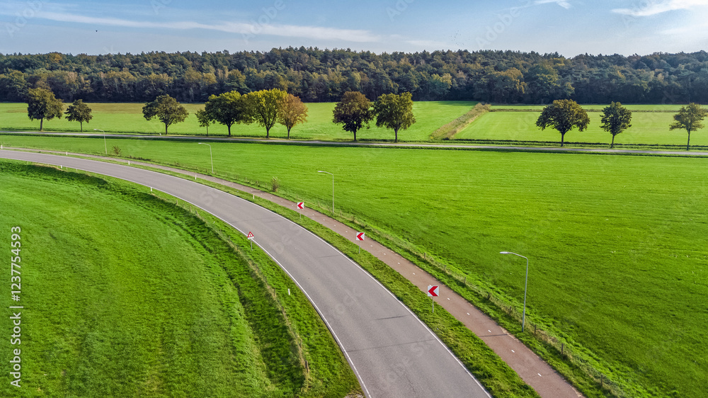 Fototapeta premium Aerial drone view of asphalt motorway road and bicycle lane from above, transportation infrastructure of the Netherlands