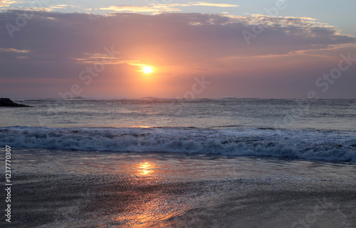 sunset reflection in the middle of the sea photo