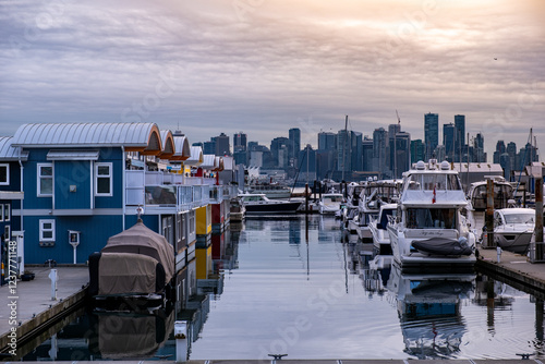 Boathouses at marina during sunset