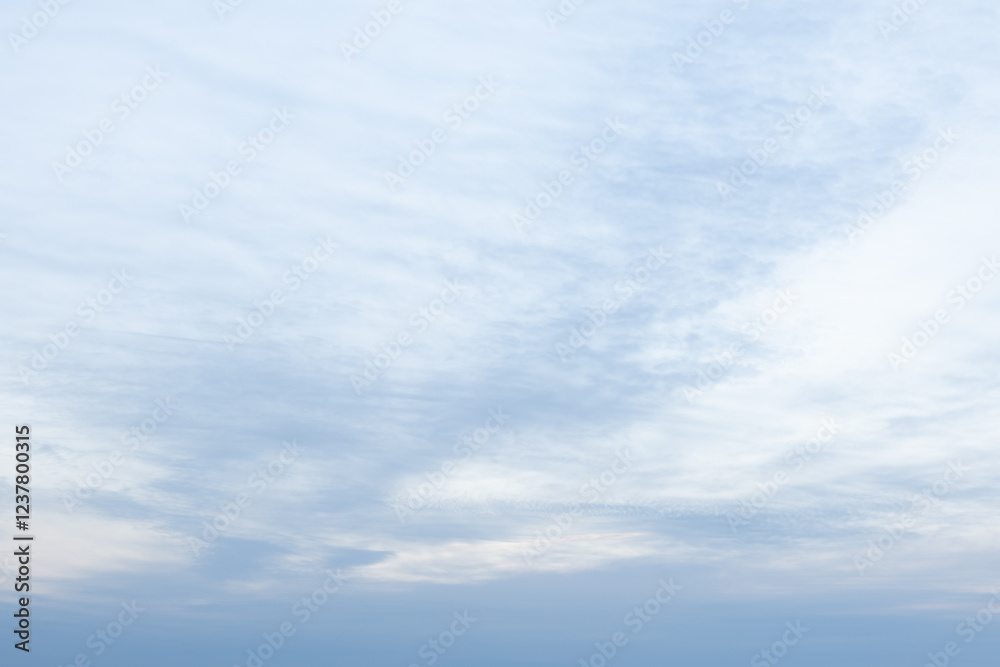 Fototapeta premium soft blue sky with textured clouds at dawn 