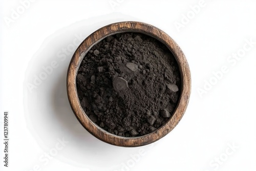 Black maca organic powder pile in cly pot isolated on white background photo