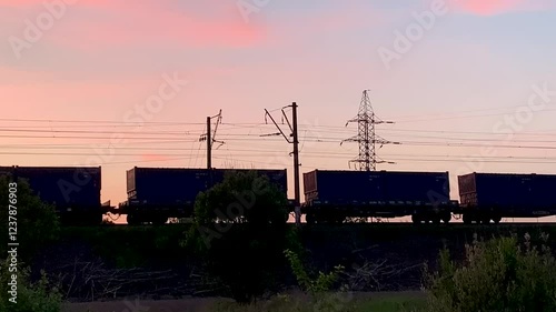 Freight Train cargo Ride At Sunset Pink Clouds Transportation Trade Logistics