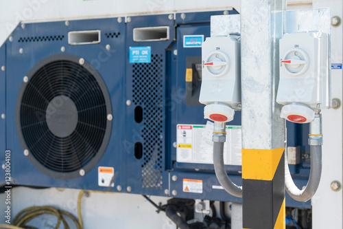 Shipping reefer container with electric socket plug at the port.