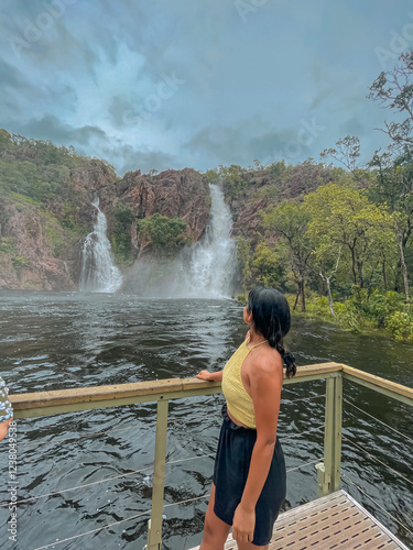 Girl looking at a waterfall_Northern Territory_Australia  photo