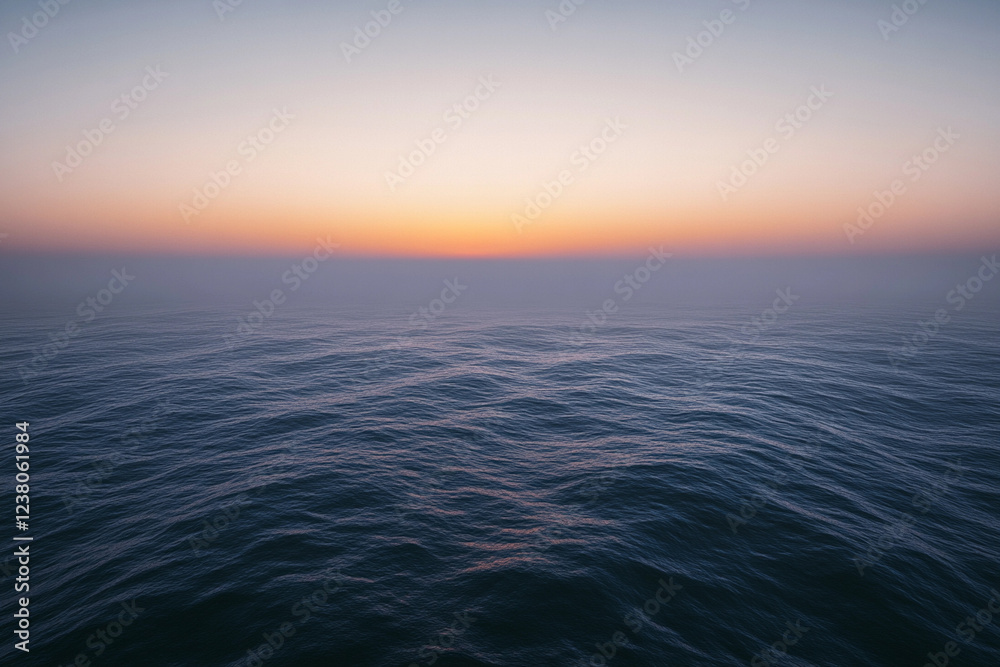Sunset over calm ocean waters creates a serene atmosphere with vibrant colors on the horizon Sunset over calm ocean waters creates a serene atmosphere with vibrant colors on the horizon