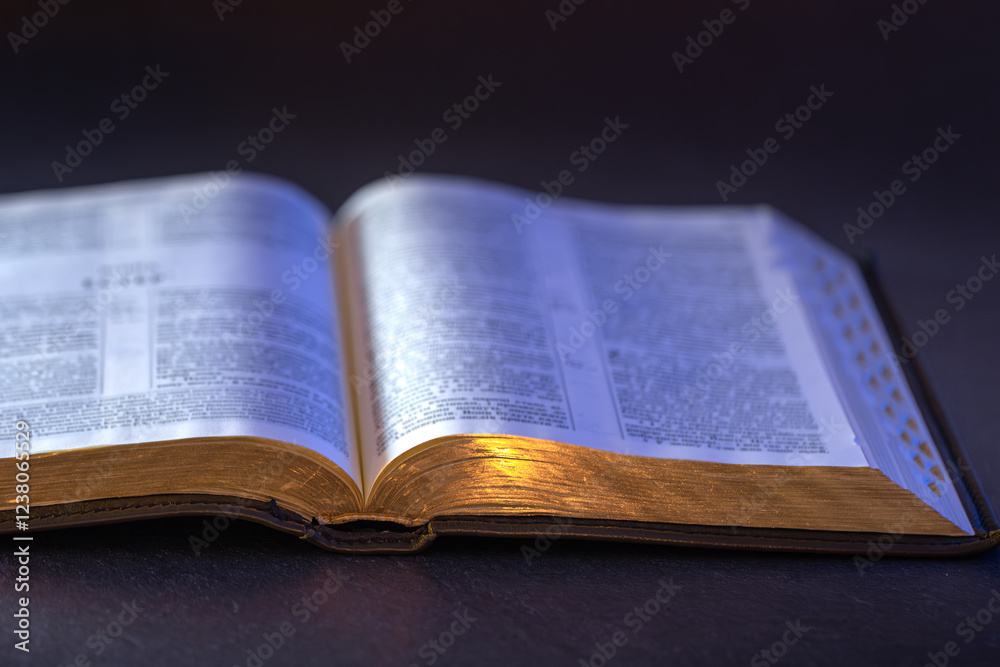 Open Holy Bible on the table. Religion concept. Bible on black background. Open Holy Bible on the table. Religion concept. Bible on black background.