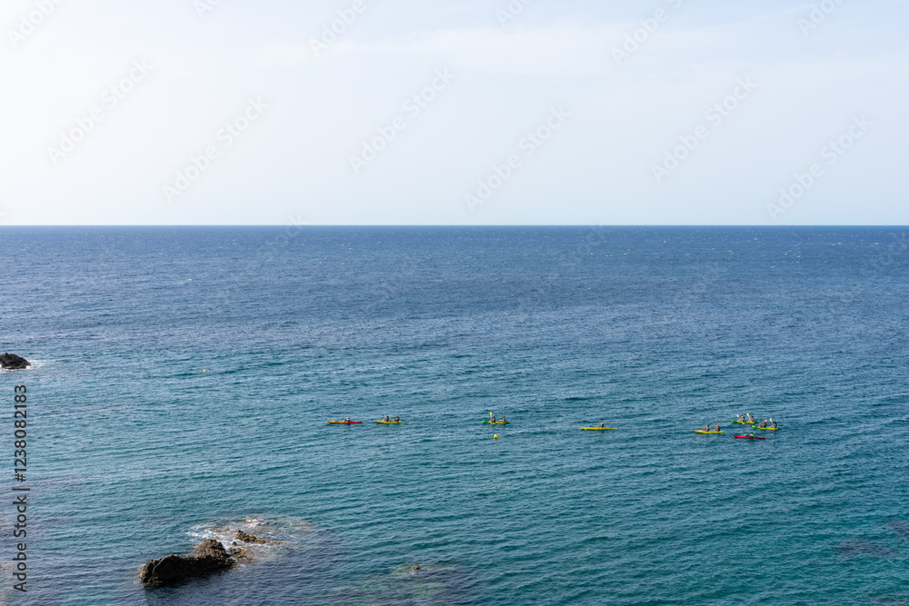 Obraz premium several kayaks in the open sea off the reefs