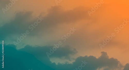 Dramatic Sunset Sky with Teal and Orange Hues Moody Cloudscape Over Mountains