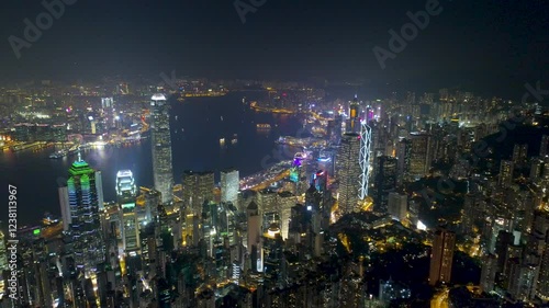 Wallpaper Mural HONG KONG, CHINA - FEBRUARY 2, 2025: Vibrant city skyline illuminated at night showcasing modern architecture and bustling waterfront life Torontodigital.ca