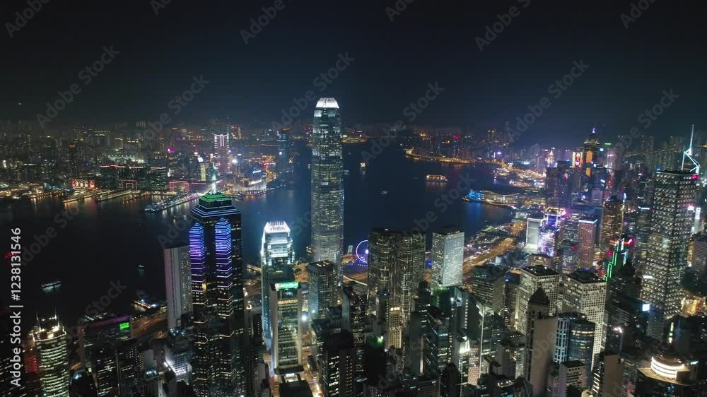 HONG KONG, CHINA - FEBRUARY 2, 2025: Night view of Hong Kong skyline with illuminated buildings and vibrant city lights over harbor HONG KONG, CHINA - FEBRUARY 2, 2025: Night view of Hong Kong skyline with illuminated buildings and vibrant city lights over harbor