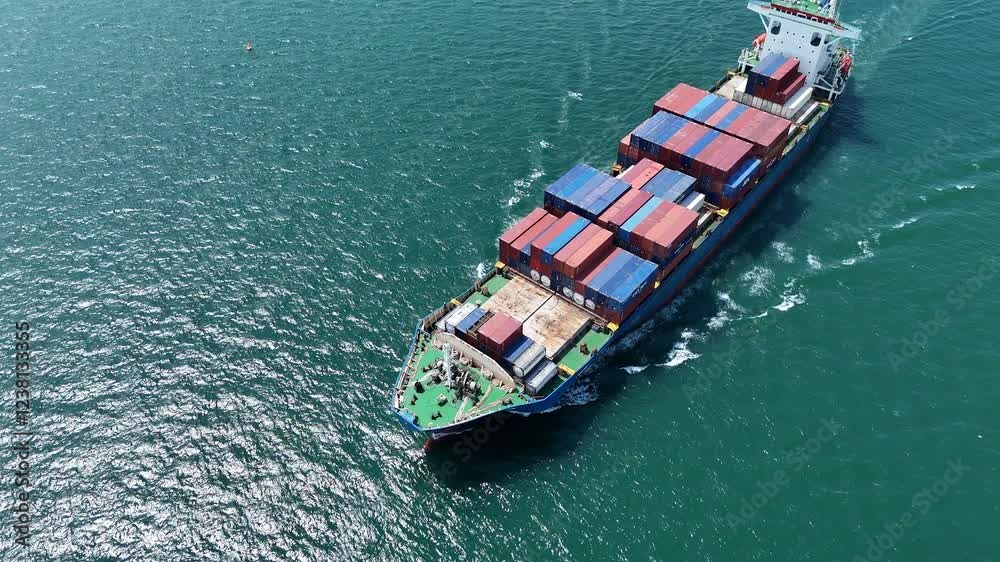 Aerial top view of cargo ship carrying container and running for export cargo yard port to custom ocean concept technology transportation , customs clearance,