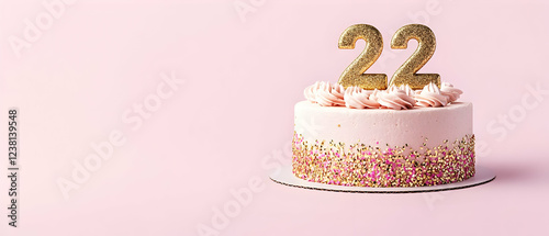 Happy Birthday 22th with gold letters on a light pink background photo